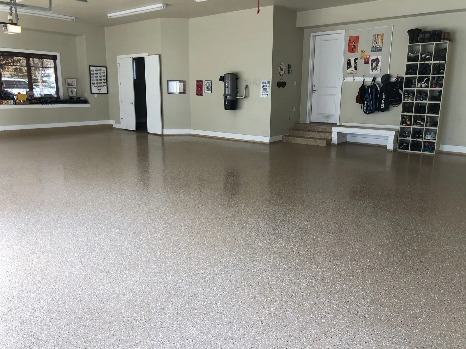 Tan flake garage floor coating with a clear top coat in a Utah two car garage