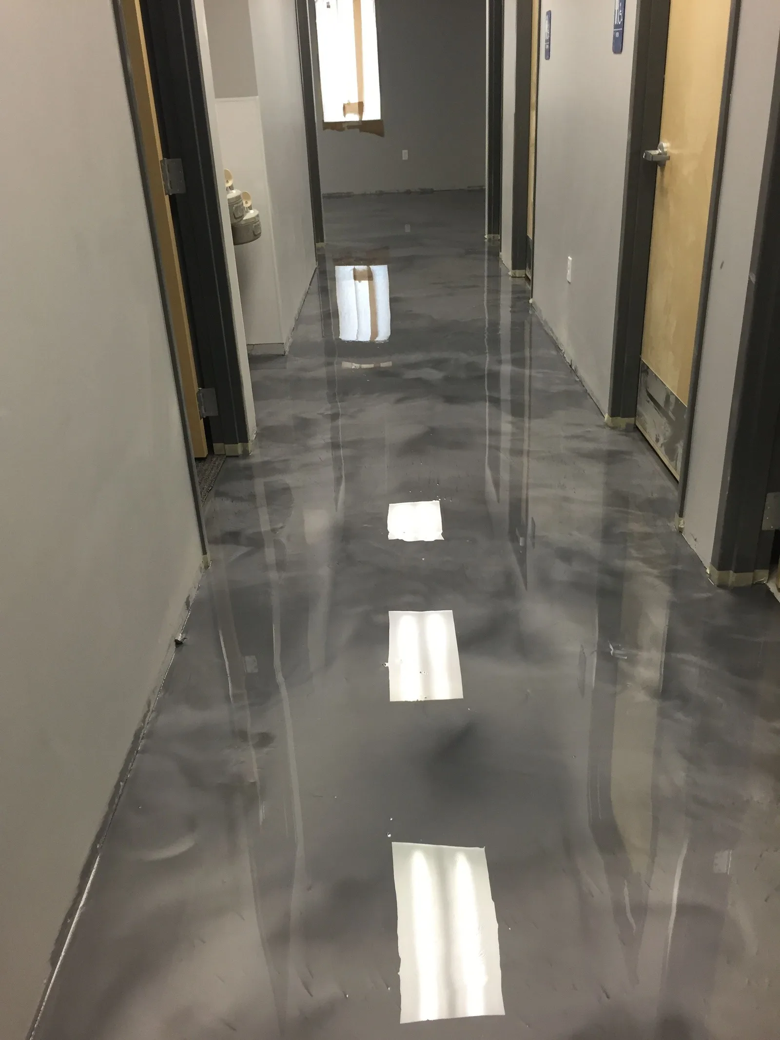 Metallic epoxy floor running down a hallway